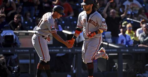 Giants open 9-run lead, hang to to beat Rockies 11-10 and stop slide